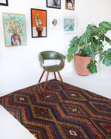 Vintage kilim rug in living room setting, bright colors, wild shaman, soft rug, bold color, Portland, Oregon, rug store, rug shop, local shop, vintage rug, modern kilim, warm colors