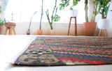 Vintage kilim rug in living room setting, bright colors, wild shaman, soft rug, bold color, Portland, Oregon, rug store, rug shop, local shop, vintage rug, modern kilim, warm colors