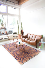 Vintage art deco rug in a living room setting, pile rug, Turkish rug, custom rug, modern rug, art deco rug,  portland, rug shop, bright colors, wild shaman, low pile rug, bold color, Portland, Oregon, rug store, rug shop, local shop, made in Turkey, vintage rug, retro rug