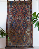 Vintage kilim rug in living room setting, old rug, antique rug, pastel colors, faded colors, Turkish rug, vintage rug, soft rug, Portland, Oregon, rug store, rug shop, local shop, earthy tones, earthy colors, warm colors