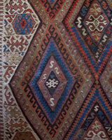 Vintage kilim rug in living room setting, old rug, antique rug, pastel colors, faded colors, Turkish rug, vintage rug, soft rug, Portland, Oregon, rug store, rug shop, local shop, earthy tones, earthy colors, warm colors