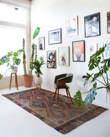 Vintage kilim rug in living room setting, old rug, antique rug, pastel colors, faded colors, Turkish rug, vintage rug, soft rug, Portland, Oregon, rug store, rug shop, local shop, earthy tones, earthy colors, warm colors