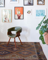 Vintage kilim rug in living room setting, old rug, antique rug, pastel colors, faded colors, Turkish rug, vintage rug, soft rug, Portland, Oregon, rug store, rug shop, local shop, earthy tones, earthy colors, warm colors