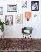 Vintage kilim rug in living room setting, old rug, antique rug, pastel colors, faded colors, Turkish rug, vintage rug, soft rug, Portland, Oregon, rug store, rug shop, local shop, earthy tones, earthy colors, warm colors