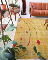 Vintage art deco rug in a living room setting, pile rug, Turkish rug, custom rug, modern rug, art deco rug,  portland, rug shop, bright colors, wild shaman, low pile rug, bold color, Portland, Oregon, rug store, rug shop, local shop, made in Turkey, vintage rug, retro rug
