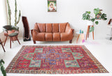 Vintage Turkish rug in living room setting, old rug, antique rug, pastel colors, faded colors, Turkish rug, vintage rug, soft rug, Portland, Oregon, rug store, rug shop, local shop