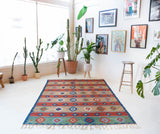 Vintage kilim rug in living room setting, bright colors, wild shaman, soft rug, bold color, Portland, Oregon, rug store, rug shop, local shop, vintage rug, modern kilim, warm colorsVintage kilim rug in living room setting, bright colors, wild shaman, soft rug, bold color, Portland, Oregon, rug store, rug shop, local shop, vintage rug, modern kilim, warm colors