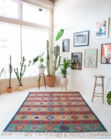 Vintage kilim rug in living room setting, bright colors, wild shaman, soft rug, bold color, Portland, Oregon, rug store, rug shop, local shop, vintage rug, modern kilim, warm colors