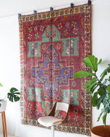 Vintage Turkish rug in living room setting, old rug, antique rug, pastel colors, faded colors, Turkish rug, vintage rug, soft rug, Portland, Oregon, rug store, rug shop, local shop
