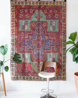 Vintage Turkish rug in living room setting, old rug, antique rug, pastel colors, faded colors, Turkish rug, vintage rug, soft rug, Portland, Oregon, rug store, rug shop, local shop