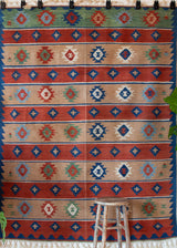 Vintage kilim rug in living room setting, bright colors, wild shaman, soft rug, bold color, Portland, Oregon, rug store, rug shop, local shop, vintage rug, modern kilim, warm colors