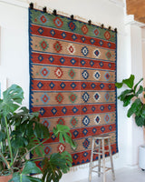 Vintage kilim rug in living room setting, bright colors, wild shaman, soft rug, bold color, Portland, Oregon, rug store, rug shop, local shop, vintage rug, modern kilim, warm colors