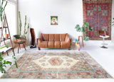 Vintage Turkish rug in living room setting, old rug, antique rug, pastel colors, faded colors, Turkish rug, vintage rug, soft rug, Portland, Oregon, rug store, rug shop, local shop