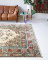 Vintage Turkish rug in living room setting, old rug, antique rug, pastel colors, faded colors, Turkish rug, vintage rug, soft rug, Portland, Oregon, rug store, rug shop, local shop