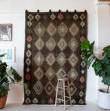 Vintage kilim rug in living room setting, bright colors, wild shaman, soft rug, bold color, Portland, Oregon, rug store, rug shop, local shop, vintage rug, modern kilim, warm colors