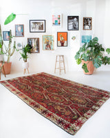 Vintage kilim rug in room decor setting, old rug, antique rug, pastel colors, faded colors, Turkish rug, vintage rug, soft rug, Portland, Oregon, rug store, rug shop, local shop, bold colors, bright colors, faded colors