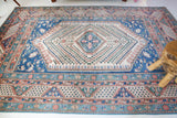 Vintage Turkish rug in living room setting, old rug, antique rug, pastel colors, faded colors, Turkish rug, vintage rug, soft rug, Portland, Oregon, rug store, rug shop, local shop