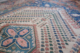 Vintage Turkish rug in living room setting, old rug, antique rug, pastel colors, faded colors, Turkish rug, vintage rug, soft rug, Portland, Oregon, rug store, rug shop, local shop