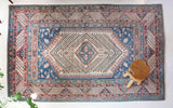 Vintage Turkish rug in living room setting, old rug, antique rug, pastel colors, faded colors, Turkish rug, vintage rug, soft rug, Portland, Oregon, rug store, rug shop, local shop