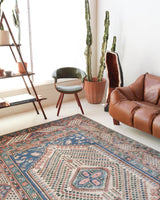 Vintage Turkish rug in living room setting, old rug, antique rug, pastel colors, faded colors, Turkish rug, vintage rug, soft rug, Portland, Oregon, rug store, rug shop, local shop