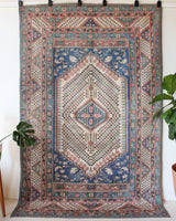 Vintage Turkish rug in living room setting, old rug, antique rug, pastel colors, faded colors, Turkish rug, vintage rug, soft rug, Portland, Oregon, rug store, rug shop, local shop
