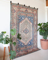 Vintage Turkish rug in living room setting, old rug, antique rug, pastel colors, faded colors, Turkish rug, vintage rug, soft rug, Portland, Oregon, rug store, rug shop, local shop