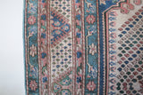 Vintage Turkish rug in living room setting, old rug, antique rug, pastel colors, faded colors, Turkish rug, vintage rug, soft rug, Portland, Oregon, rug store, rug shop, local shop