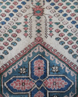 Vintage Turkish rug in living room setting, old rug, antique rug, pastel colors, faded colors, Turkish rug, vintage rug, soft rug, Portland, Oregon, rug store, rug shop, local shop