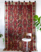 Vintage kilim rug in room decor setting, old rug, antique rug, pastel colors, faded colors, Turkish rug, vintage rug, soft rug, Portland, Oregon, rug store, rug shop, local shop, bold colors, bright colors, faded colors