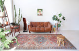 Vintage Turkish rug in living room setting, old rug, antique rug, pastel colors, faded colors, Turkish rug, vintage rug, soft rug, Portland, Oregon, rug store, rug shop, local shop