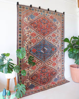 Vintage Turkish rug in living room setting, old rug, antique rug, pastel colors, faded colors, Turkish rug, vintage rug, soft rug, Portland, Oregon, rug store, rug shop, local shop