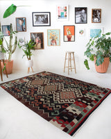 Vintage kilim rug in room decor setting, old rug, antique rug, pastel colors, faded colors, Turkish rug, vintage rug, soft rug, Portland, Oregon, rug store, rug shop, local shop, bold colors, bright colors, faded colors