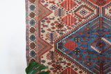 Vintage Turkish rug in living room setting, old rug, antique rug, pastel colors, faded colors, Turkish rug, vintage rug, soft rug, Portland, Oregon, rug store, rug shop, local shop