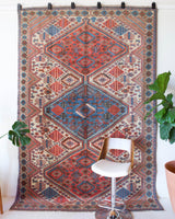 Vintage Turkish rug in living room setting, old rug, antique rug, pastel colors, faded colors, Turkish rug, vintage rug, soft rug, Portland, Oregon, rug store, rug shop, local shop