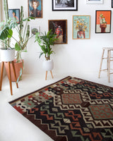 Vintage kilim rug in room decor setting, old rug, antique rug, pastel colors, faded colors, Turkish rug, vintage rug, soft rug, Portland, Oregon, rug store, rug shop, local shop, bold colors, bright colors, faded colors