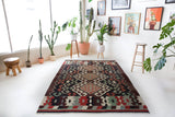 Vintage kilim rug in room decor setting, old rug, antique rug, pastel colors, faded colors, Turkish rug, vintage rug, soft rug, Portland, Oregon, rug store, rug shop, local shop, bold colors, bright colors, faded colors