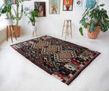 Vintage kilim rug in room decor setting, old rug, antique rug, pastel colors, faded colors, Turkish rug, vintage rug, soft rug, Portland, Oregon, rug store, rug shop, local shop, bold colors, bright colors, faded colors