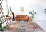 Vintage Turkish rug in living room setting, old rug, antique rug, pastel colors, faded colors, Turkish rug, vintage rug, soft rug, Portland, Oregon, rug store, rug shop, local shop