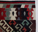 Vintage kilim rug in room decor setting, old rug, antique rug, pastel colors, faded colors, Turkish rug, vintage rug, soft rug, Portland, Oregon, rug store, rug shop, local shop, bold colors, bright colors, faded colors