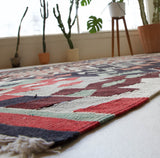 Vintage kilim rug in room decor setting, old rug, antique rug, pastel colors, faded colors, Turkish rug, vintage rug, soft rug, Portland, Oregon, rug store, rug shop, local shop, bold colors, bright colors, faded colors