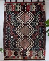 Vintage kilim rug in room decor setting, old rug, antique rug, pastel colors, faded colors, Turkish rug, vintage rug, soft rug, Portland, Oregon, rug store, rug shop, local shop, bold colors, bright colors, faded colors