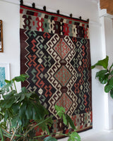 Vintage kilim rug in room decor setting, old rug, antique rug, pastel colors, faded colors, Turkish rug, vintage rug, soft rug, Portland, Oregon, rug store, rug shop, local shop, bold colors, bright colors, faded colors