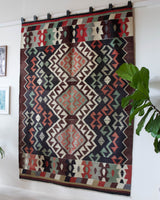 Vintage kilim rug in room decor setting, old rug, antique rug, pastel colors, faded colors, Turkish rug, vintage rug, soft rug, Portland, Oregon, rug store, rug shop, local shop, bold colors, bright colors, faded colors