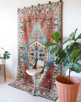 Vintage Turkish rug in living room setting, old rug, antique rug, pastel colors, faded colors, Turkish rug, vintage rug, soft rug, Portland, Oregon, rug store, rug shop, local shop