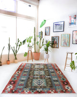 Vintage kilim rug in living room setting, bright colors, wild shaman, soft rug, bold color, Portland, Oregon, rug store, rug shop, local shop, vintage rug, modern kilim, warm colors