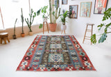 Vintage kilim rug in living room setting, bright colors, wild shaman, soft rug, bold color, Portland, Oregon, rug store, rug shop, local shop, vintage rug, modern kilim, warm colors