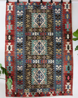 Vintage kilim rug in living room setting, bright colors, wild shaman, soft rug, bold color, Portland, Oregon, rug store, rug shop, local shop, vintage rug, modern kilim, warm colors