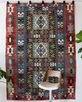 Vintage kilim rug in living room setting, bright colors, wild shaman, soft rug, bold color, Portland, Oregon, rug store, rug shop, local shop, vintage rug, modern kilim, warm colors