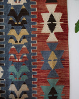 Vintage kilim rug in living room setting, bright colors, wild shaman, soft rug, bold color, Portland, Oregon, rug store, rug shop, local shop, vintage rug, modern kilim, warm colors