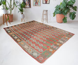 Vintage kilim rug in living room setting, old rug, antique rug, pastel colors, faded colors, Turkish rug, vintage rug, soft rug, Portland, Oregon, rug store, rug shop, local shop, earthy tones, earthy colors, warm colorsVintage kilim rug in living room setting, old rug, antique rug, pastel colors, faded colors, Turkish rug, vintage rug, soft rug, Portland, Oregon, rug store, rug shop, local shop, earthy tones, earthy colors, warm colors
